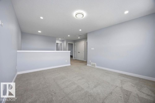 1057 Coopers Hawk Link, Edmonton, AB - Indoor Photo Showing Other Room