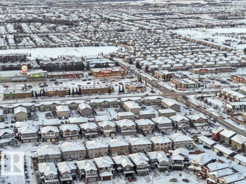 Aerial view of the neighborhood showing commercial properties, residential buildings, and roadways - 1912 27 Street Nw, Edmonton, AB - Outdoor With View