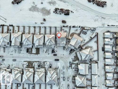 Aerial view of the property and surrounding neighborhood, featuring residential homes with pitched roofs - 1912 27 Street Nw, Edmonton, AB - Other