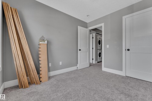 Room with light gray walls, gray carpet, and white trim - 195 Kirpatrick Way, Leduc, AB - Indoor