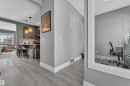 This property features hard surface flooring, light gray walls, and white baseboards throughout - 195 Kirpatrick Way, Leduc, AB  - Indoor 