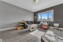 Living space featuring light-toned flooring and a large window providing natural light - 195 Kirpatrick Way, Leduc, AB  - Indoor Photo Showing Living Room 