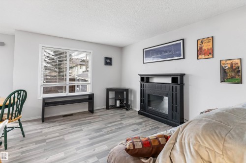 73 1428 Hodgson Way, Edmonton, AB - Indoor Photo Showing Other Room With Fireplace