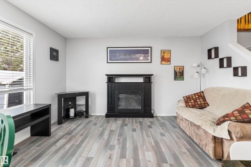 73 1428 Hodgson Way, Edmonton, AB - Indoor Photo Showing Living Room With Fireplace