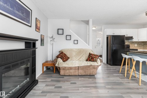 73 1428 Hodgson Way, Edmonton, AB - Indoor Photo Showing Living Room With Fireplace