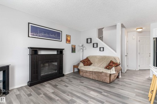 73 1428 Hodgson Way, Edmonton, AB - Indoor Photo Showing Living Room With Fireplace
