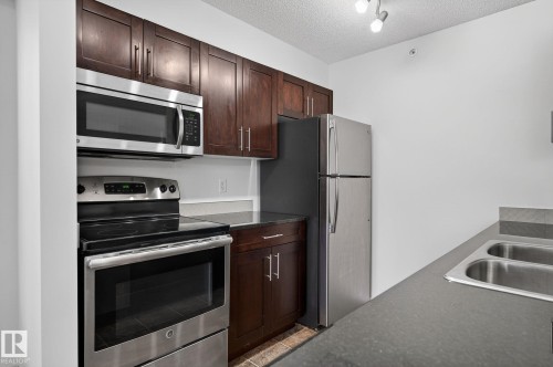 227 5370 Chappelle Road, Edmonton, AB - Indoor Photo Showing Kitchen With Stainless Steel Kitchen With Double Sink