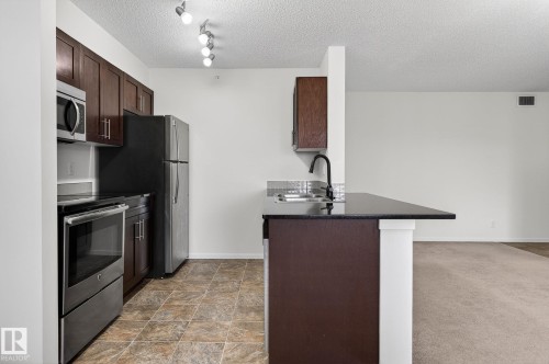 227 5370 Chappelle Road, Edmonton, AB - Indoor Photo Showing Kitchen