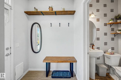 Mudroom featuring baseboards and light wood finished floors - 4110 Allan Crescent, Edmonton, AB - Indoor