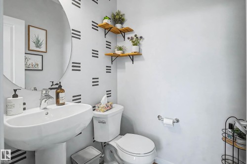 Bathroom featuring toilet and baseboards - 4110 Allan Crescent, Edmonton, AB - Indoor Photo Showing Bathroom