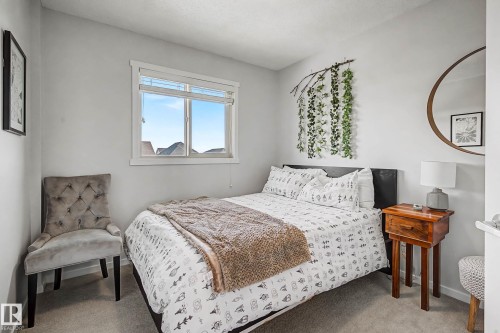 Bedroom featuring light carpet - 4110 Allan Crescent, Edmonton, AB - Indoor Photo Showing Bedroom