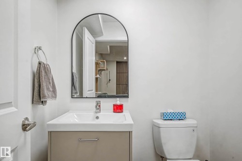 Half bathroom with vanity and toilet - 4110 Allan Crescent, Edmonton, AB - Indoor Photo Showing Bathroom