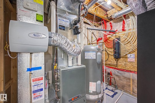 Utilities featuring water heater and heating unit - 4110 Allan Crescent, Edmonton, AB - Indoor Photo Showing Basement