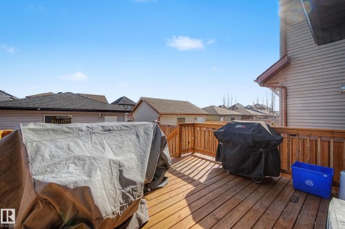 Wooden deck with a residential view and area for grilling - 4110 Allan Crescent, Edmonton, AB - Outdoor With Deck Patio Veranda With Exterior