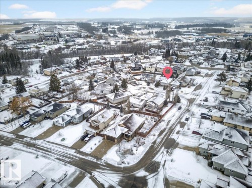 Aerial view of the property and surrounding neighborhood, featuring residential homes with snow-covered roofs and grounds - 4412 Yeoman Close, Onoway, AB - Outdoor With View