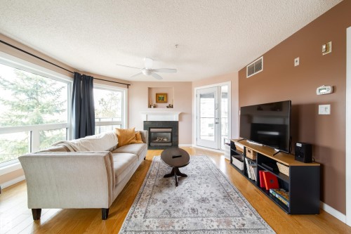 409 7839 96 Street, Edmonton, AB - Indoor Photo Showing Living Room With Fireplace