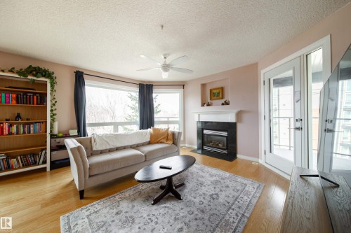 409 7839 96 Street, Edmonton, AB - Indoor Photo Showing Living Room With Fireplace