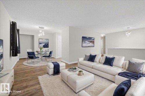 Potential for upper laundry in back closet - 4302 52 Street, Leduc, AB - Indoor Photo Showing Living Room