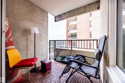The property features an exterior balcony with a tiled floor, overlooking views of the surrounding buildings - 803 12303 Jasper Avenue, Edmonton, AB -  Photo Showing Other Room