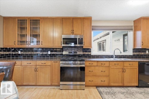 4312 37 Avenue, Leduc, AB - Indoor Photo Showing Kitchen With Double Sink