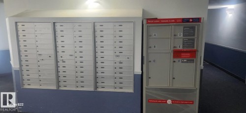 Mailboxes and a parcel locker are present in the hallway - 204 11218 80 Street, Edmonton, AB - Indoor