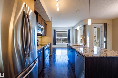 117 10523 123 Street, Edmonton, AB - Indoor Photo Showing Kitchen With Stainless Steel Kitchen With Double Sink With Upgraded Kitchen