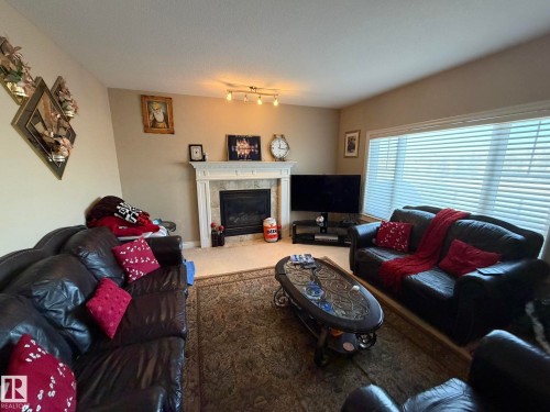 551 Stewart Crescent, Edmonton, AB - Indoor Photo Showing Living Room With Fireplace