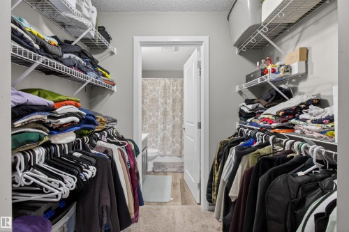 This property offers a walk-in closet with wire shelving and hanging rods - 134 148 Ebbers Boulevard, Edmonton, AB - Indoor With Storage