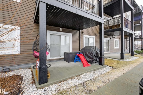 Concrete patio area providing outdoor living space - 134 148 Ebbers Boulevard, Edmonton, AB - Outdoor With Exterior