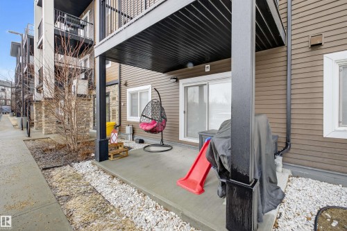 This property features a private patio area with a concrete surface, providing a versatile outdoor space - 134 148 Ebbers Boulevard, Edmonton, AB - Outdoor With Exterior