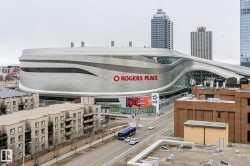 The property is located in a vibrant urban setting with views of a modern stadium and surrounding cityscape - 