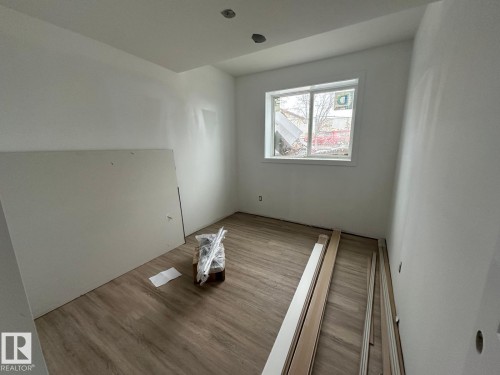 Room featuring light wood-style flooring and a window providing natural light - 9214 152 Street, Edmonton, AB - Indoor Photo Showing Other Room