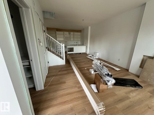 Open concept living area with hardwood flooring and white walls - 9214 152 Street, Edmonton, AB - Indoor Photo Showing Other Room