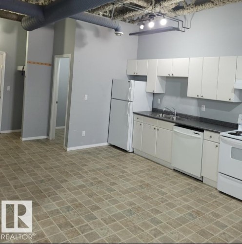 102 9817 103 Street, Fort Saskatchewan, AB - Indoor Photo Showing Kitchen With Double Sink