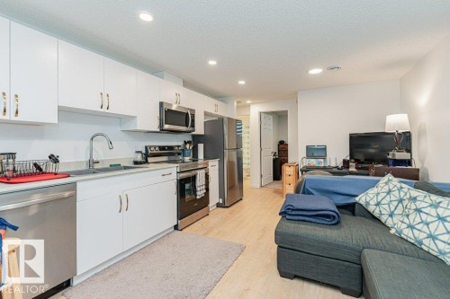 Well-appointed kitchen featuring white cabinetry, stainless steel appliances, and a light-colored countertop - 9652 Colak Link Link, Edmonton, AB - Indoor Photo Showing Kitchen