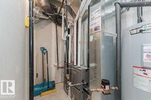 The property includes a water heater and furnace system - 9652 Colak Link Link, Edmonton, AB - Indoor Photo Showing Basement