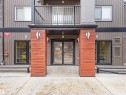 The property features a modern exterior with horizontal siding and wood-look accents - 214 394 Windermere Road, Edmonton, AB  - Outdoor With Balcony 