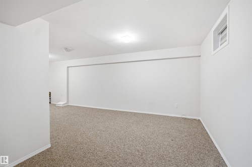 This room features light-colored carpeting, white walls, and recessed lighting - 16049 95 Avenue, Edmonton, AB - Indoor Photo Showing Other Room