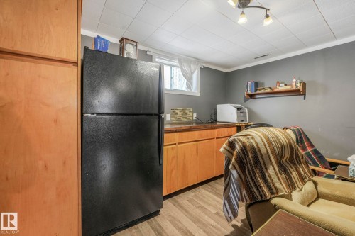 Has partial kitchen with extra Refrigerator - 12032 55 Street Nw, Edmonton, AB - Indoor