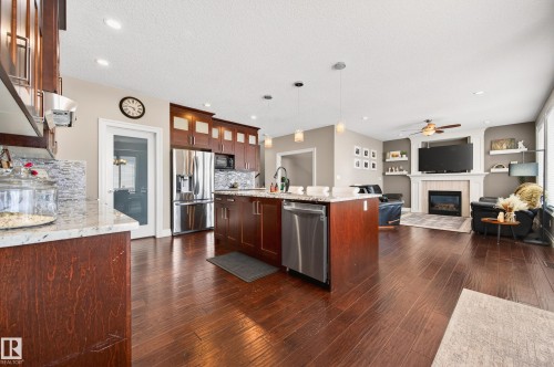 5204 Rue Eaglemont, Beaumont, AB - Indoor Photo Showing Kitchen With Fireplace With Upgraded Kitchen