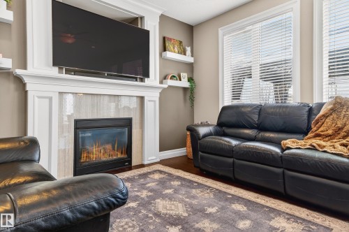 5204 Rue Eaglemont, Beaumont, AB - Indoor Photo Showing Living Room With Fireplace
