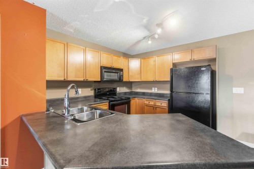 314 13830 150 Avenue, Edmonton, AB - Indoor Photo Showing Kitchen With Double Sink