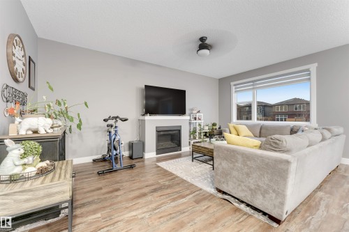 2987 Chokecherry Common, Edmonton, AB - Indoor Photo Showing Living Room With Fireplace