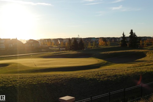 Property with a view of a golf course, featuring a green and sand traps, surrounded by grassy hills - 1003 Huckell Place, Edmonton, AB - Outdoor With View