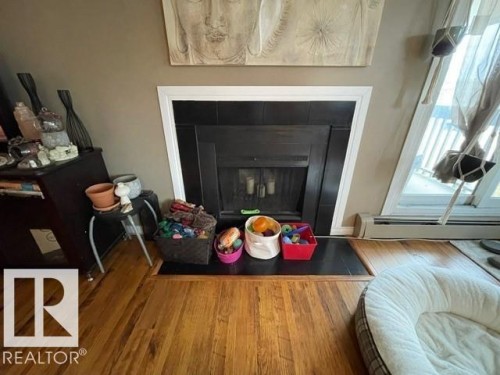 208 14803 51 Avenue, Edmonton, AB - Indoor Photo Showing Living Room With Fireplace