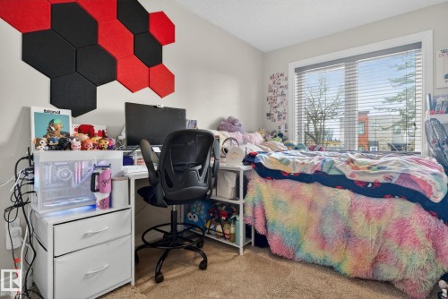 This room features carpeted flooring, a window with blinds, and light-colored walls - 10418 69 Avenue, Edmonton, AB - Indoor Photo Showing Bedroom