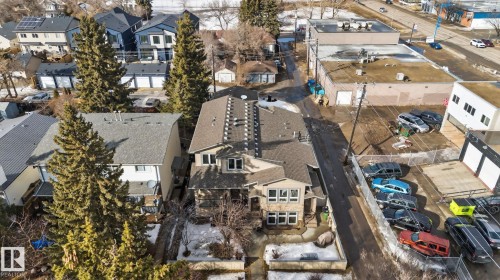 This property features a multi-level design with a light-colored facade and visible roofline - 10418 69 Avenue, Edmonton, AB - Outdoor With View