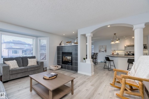 66 Bridgeport Wynd, Leduc, AB - Indoor Photo Showing Living Room With Fireplace