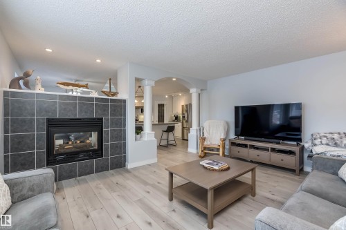 66 Bridgeport Wynd, Leduc, AB - Indoor Photo Showing Living Room With Fireplace