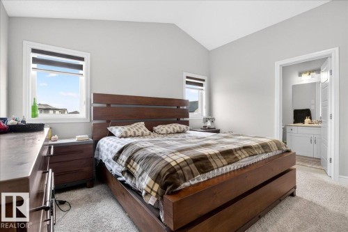 This room features light-colored walls and carpeted flooring - 203 Cavanagh Common, Edmonton, AB - Indoor Photo Showing Bedroom